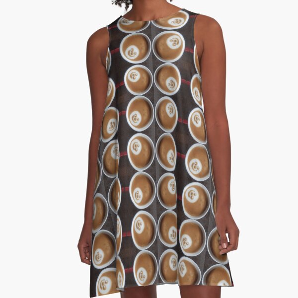 Model wearing Latte Art on Coffee A-line dress – cute silly face latte foam print by South Australian artist Avril Thomas, fun coffee lover fashion, swing fit dress availa