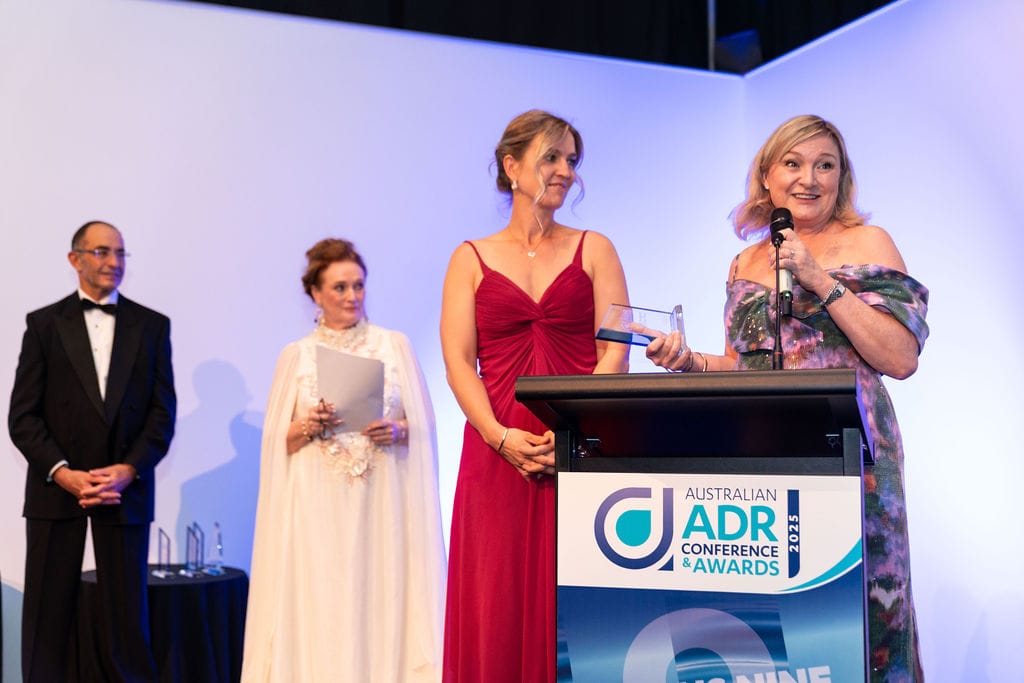 Sharyn Green-Arndt accepting the award on behalf of The Co-Parenting Institute.