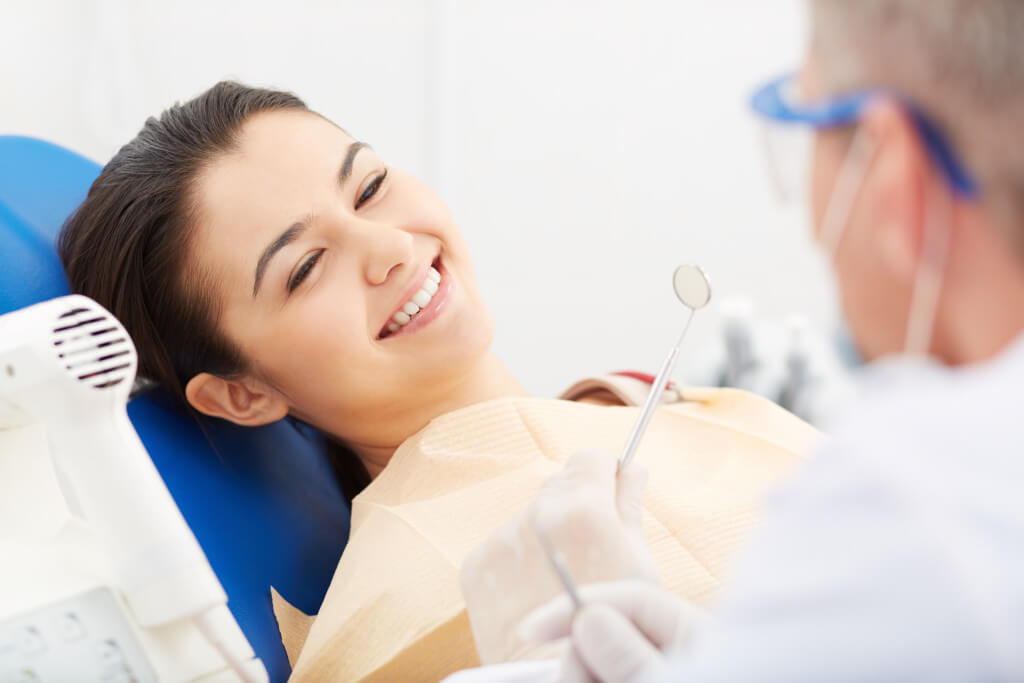 Dental patient getting teeth cleaned