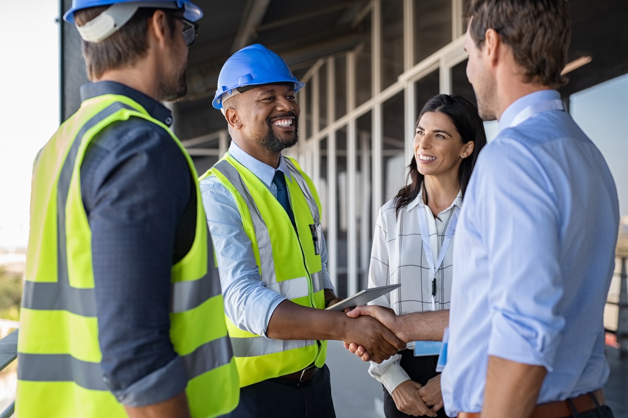 Engineer and businessman handshake at construction site Engineer and businessman handshake at construction site