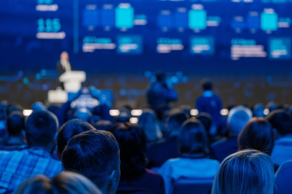 Professional,Conference,With,Speaker,Presenting,To,An,Audience,In,A