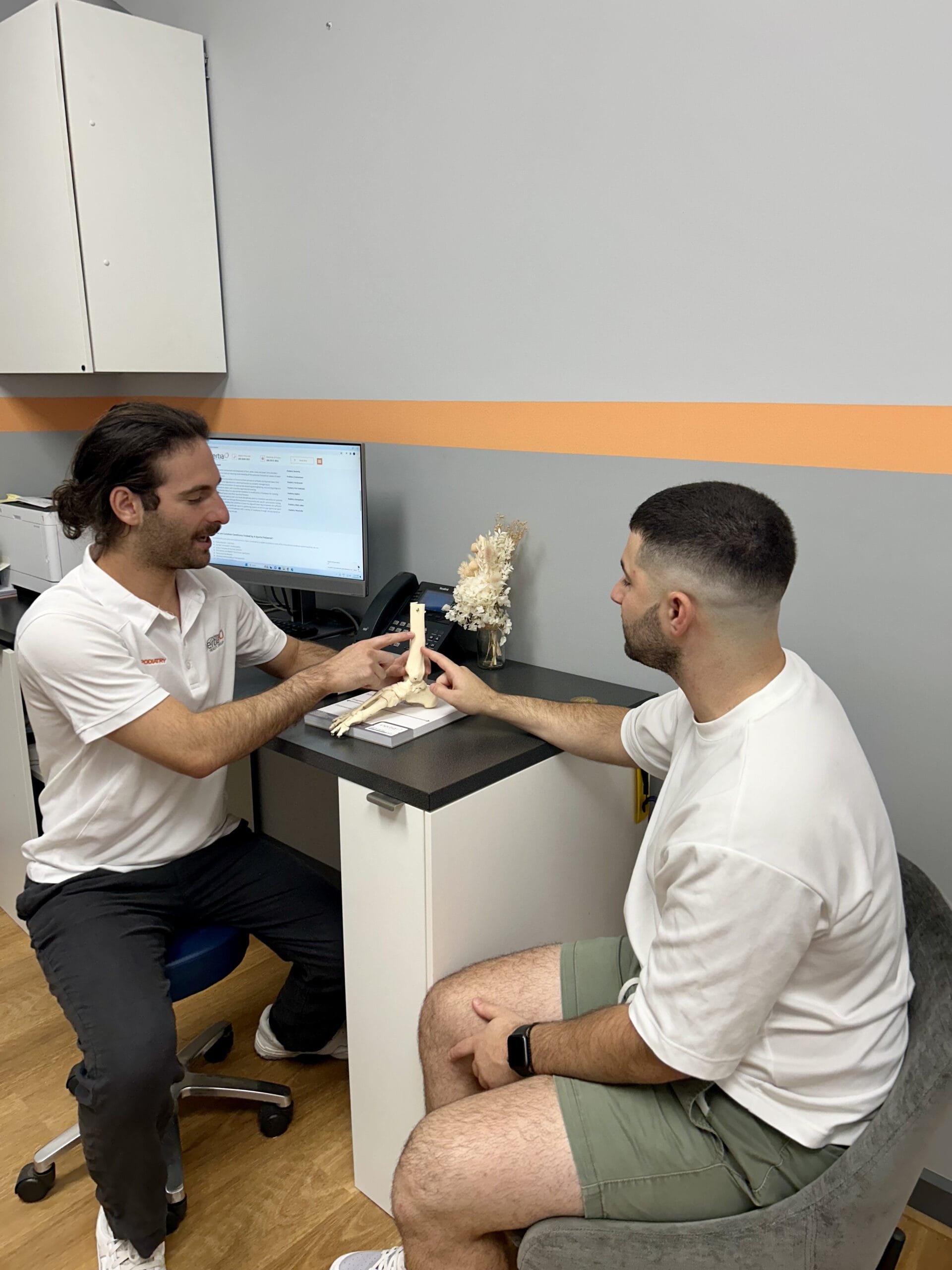 A podiatrist at Inertia Health Group Clinic conducting a detailed examination on a patient, focusing on foot and ankle health.

	</font>
	</td></tr>
	<tr><td align=left> </td></tr>	</table>





</td></tr>
</table>



</center>




<!--
=================================================================================================
=================================================================================================
-->

<center>
<table width=