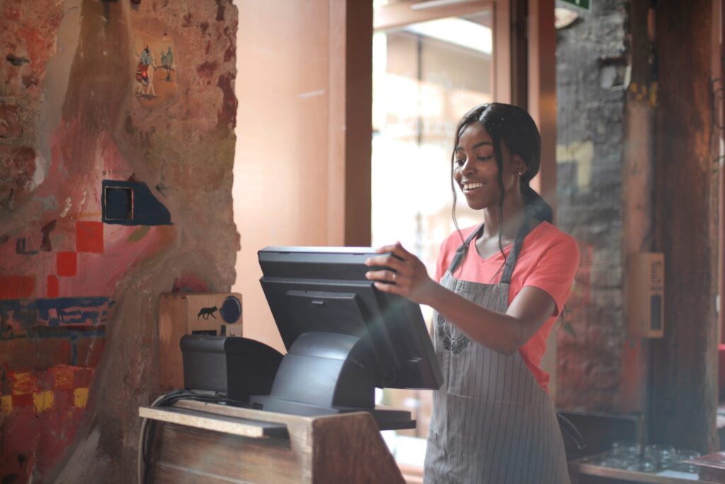 young-female-working-on-cash-register-3801422-scaled-1