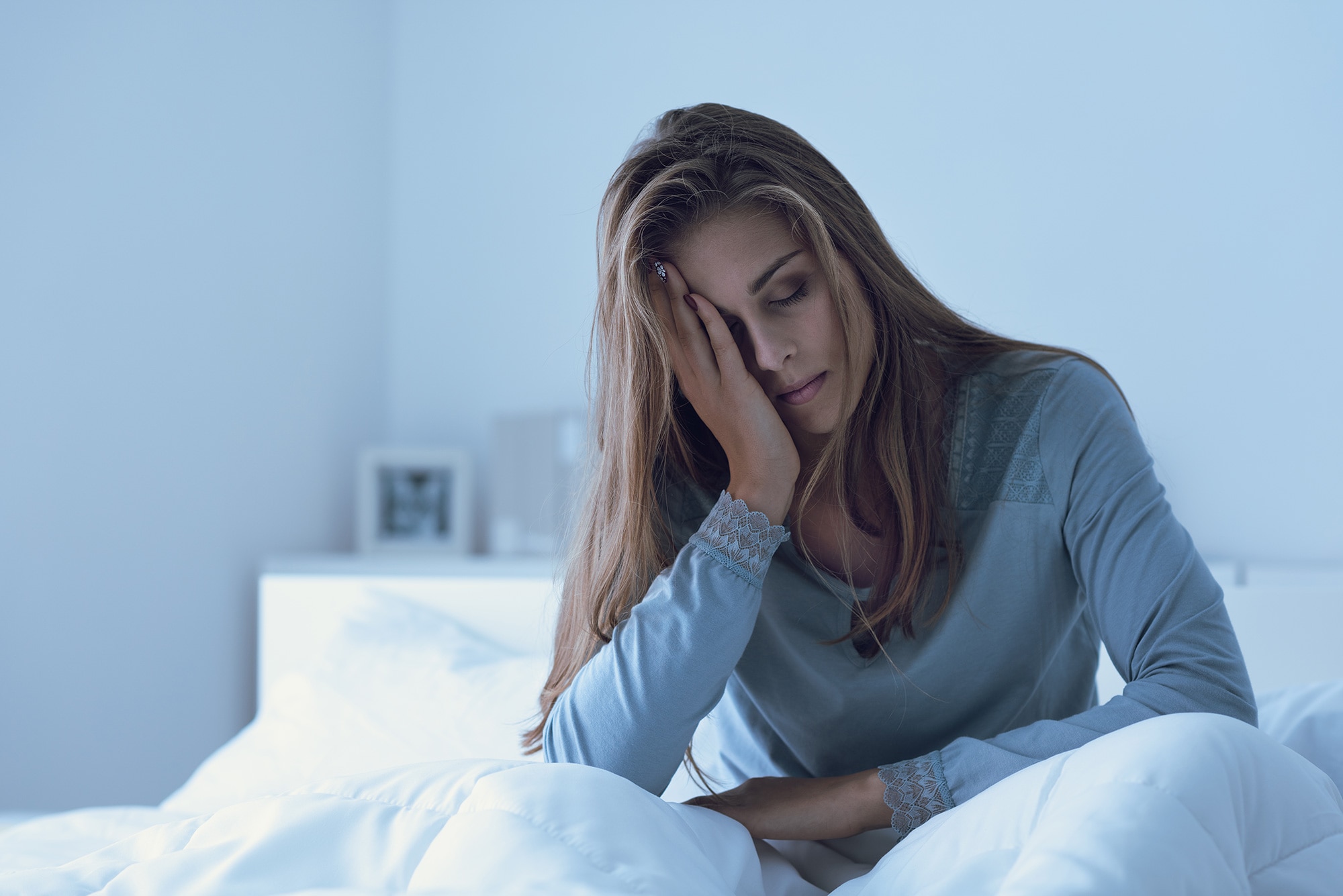 Fatigued woman suffering from long COVID symptoms in Australia.