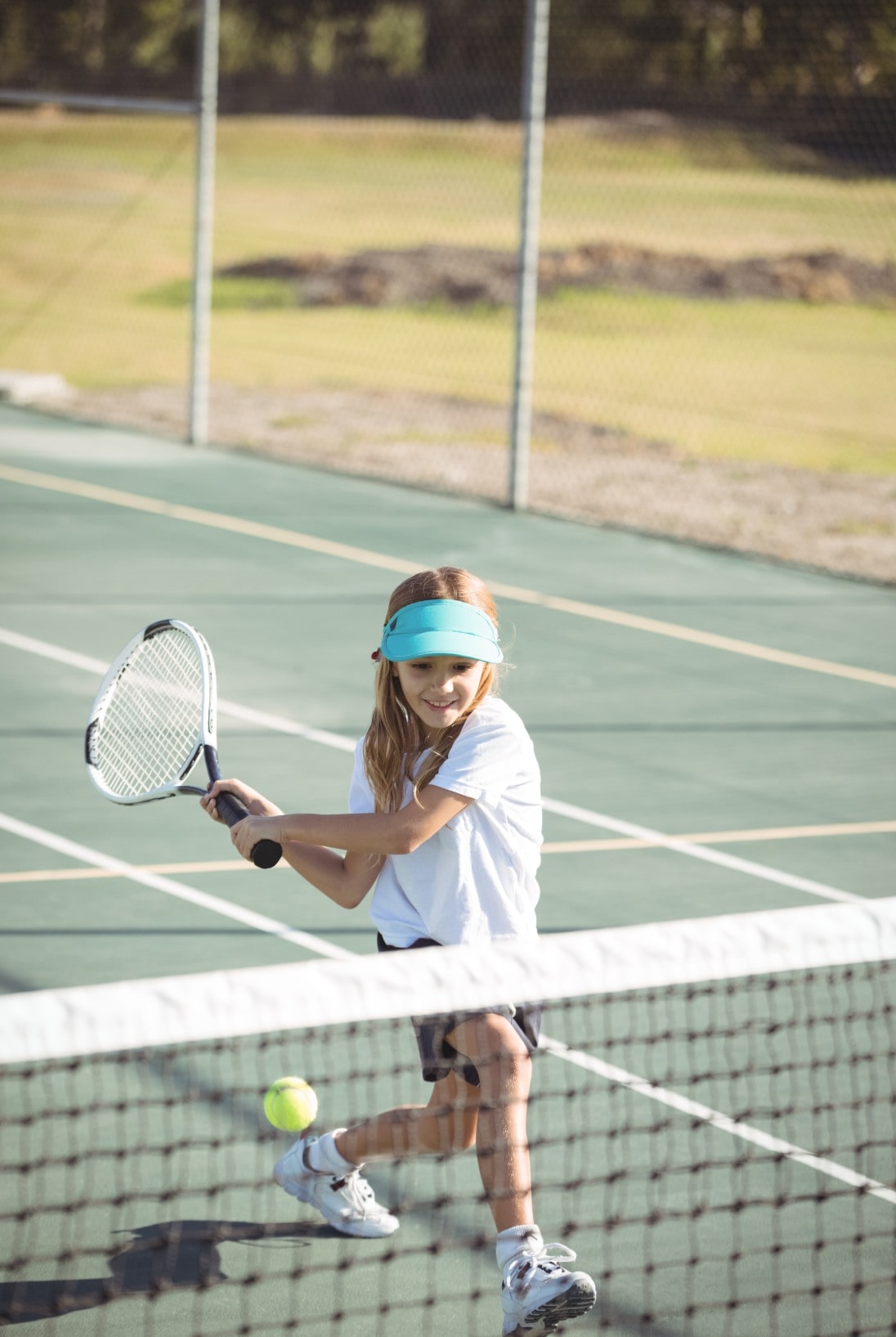 girl-playing-tennis-on-court