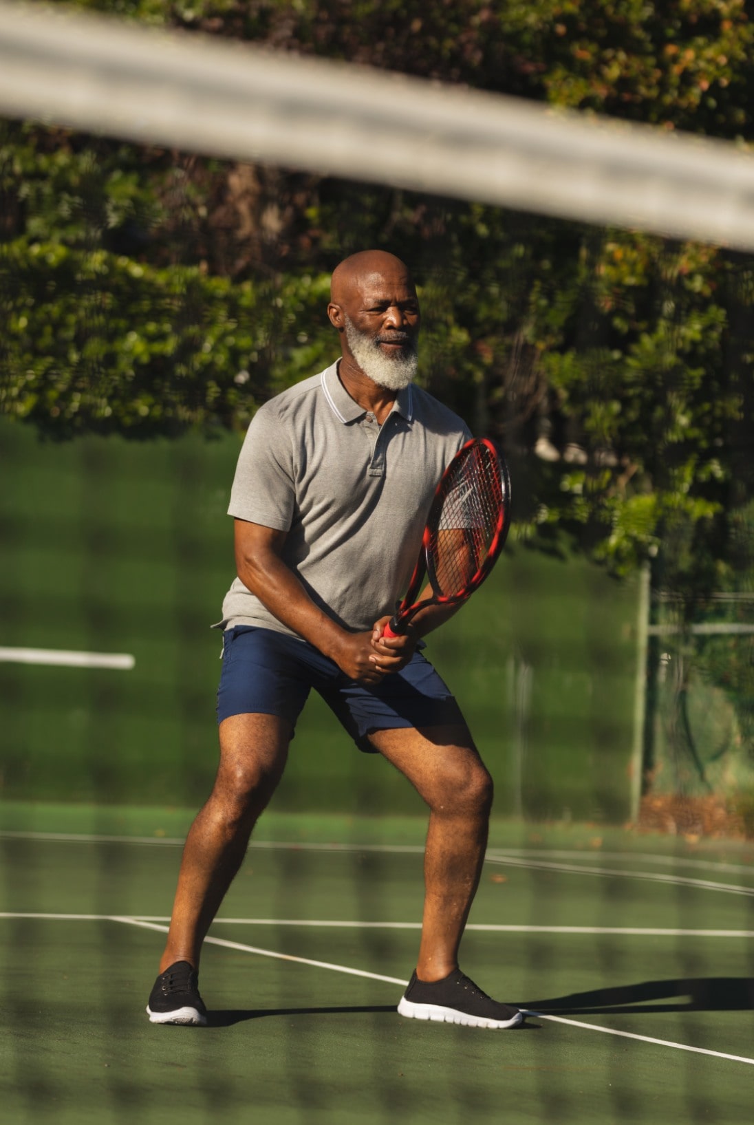 senior-african-american-man-playing-tennis