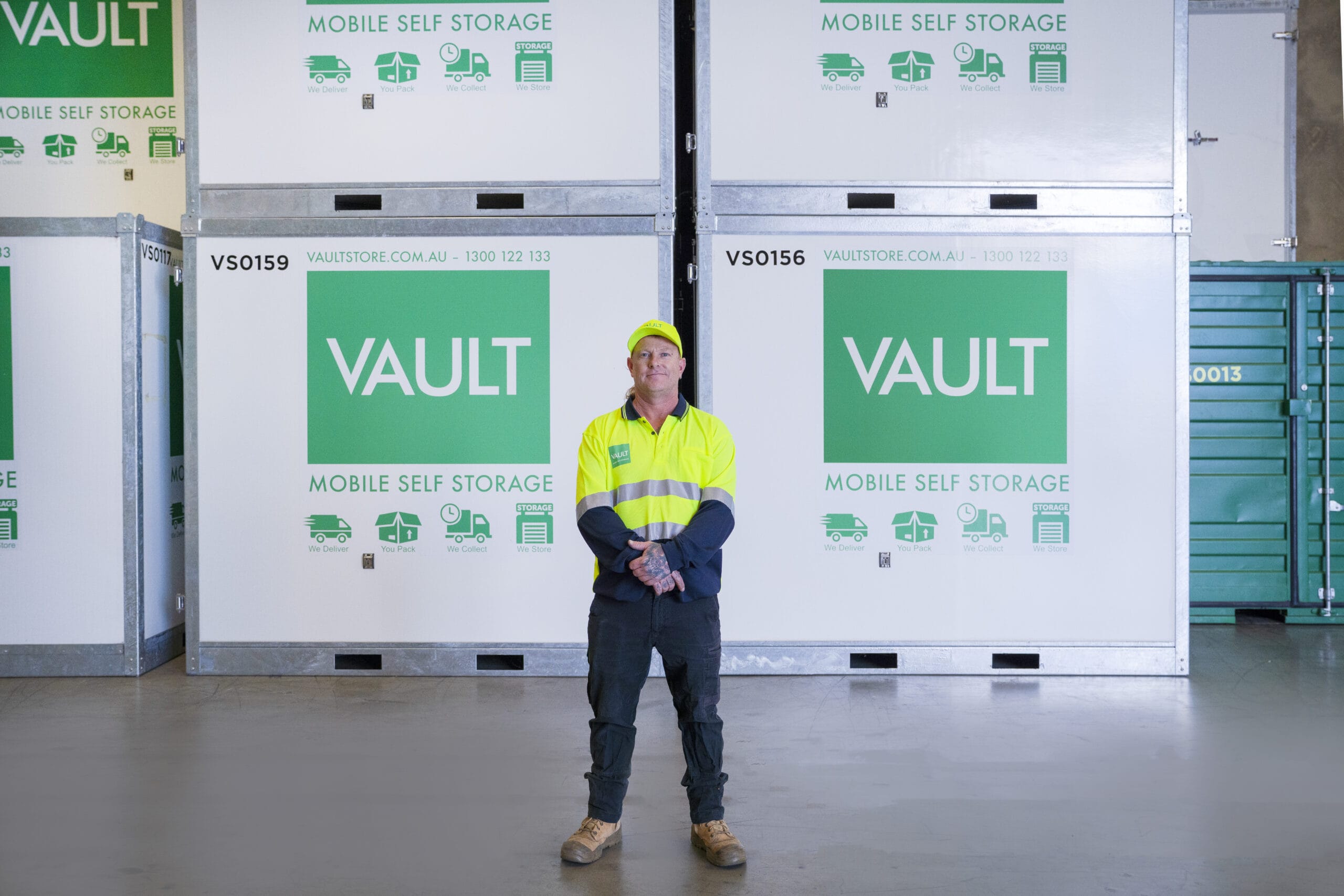 Vault Store employee standing behind Vault Store Mobile Storage