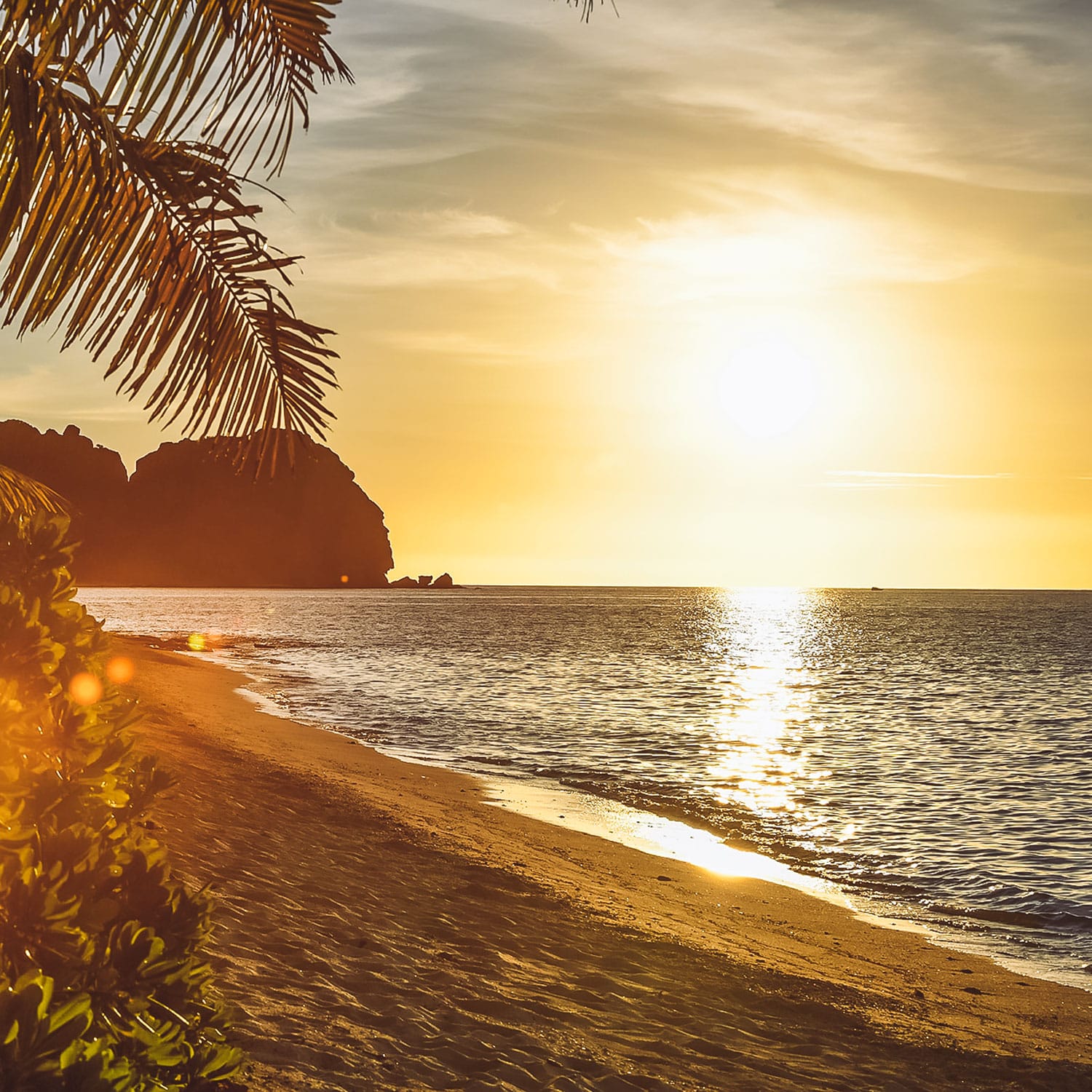 Vomo golden sunset looking toward vomo lailai Vomo golden sunset looking toward vomo lailai