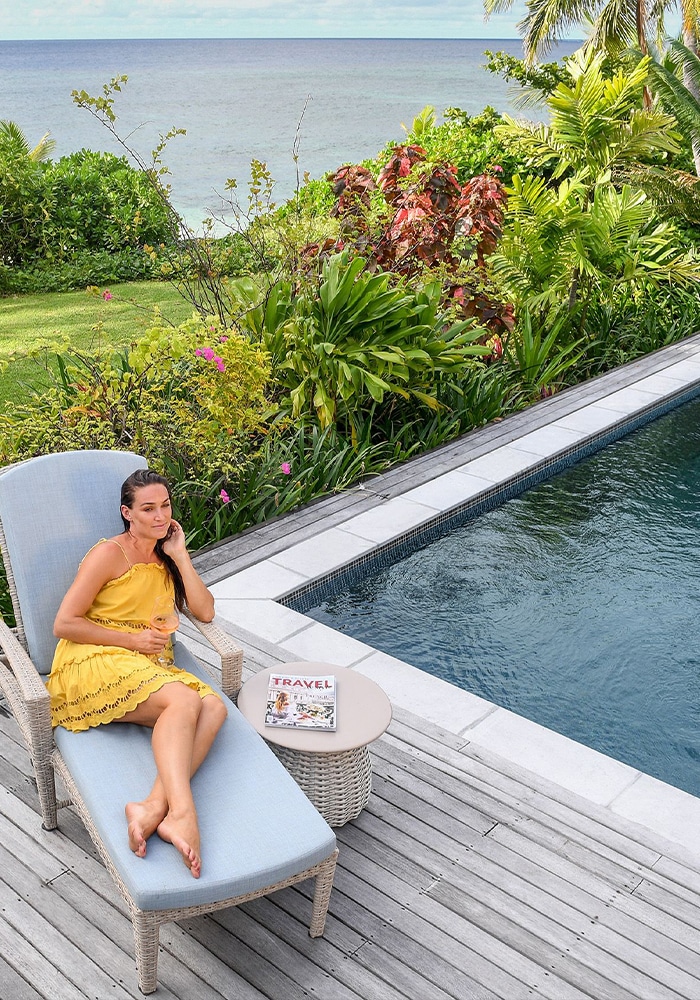 Mother relaxing poolside at the royal luxury fiji accommodation on vomo island fiji